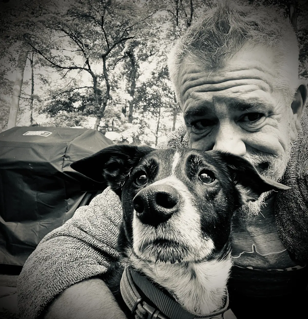 Ciaran Paul Roche sitting outdoors with Phinny